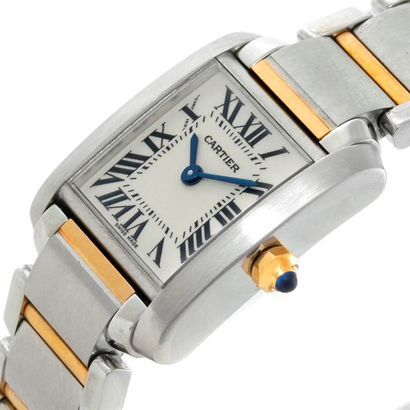 The image shows a close-up angle of a Cartier Tank Française watch, focusing on its face, crown, and part of the bracelet.