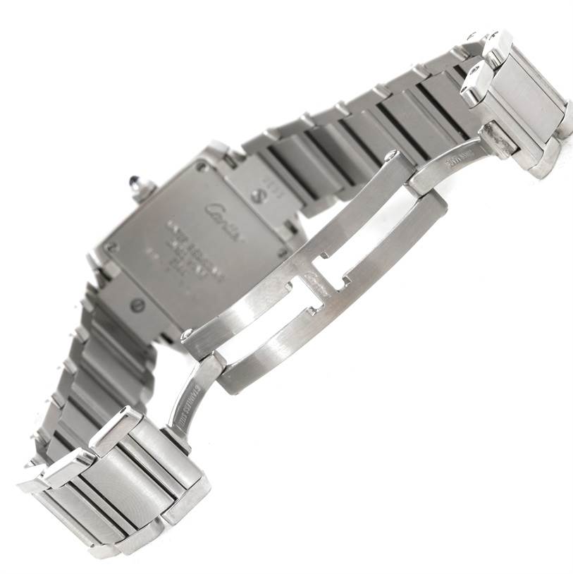 The image shows the back and clasp of a Cartier Tank Francaise W51008Q3 Women's Stainless Steel Silver Dial W51008Q3 Women's Stainless Steel Silver Dial watch at an angle highlighting its stainless steel bracelet and deployment clasp.