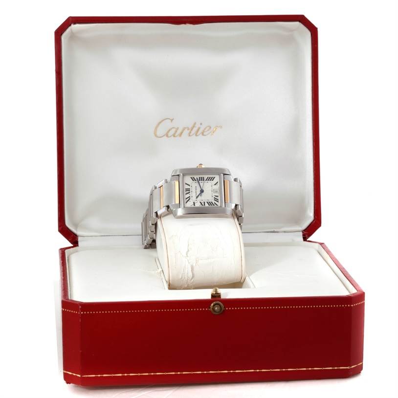 The Cartier Tank Française watch is displayed face up in an open red Cartier box.