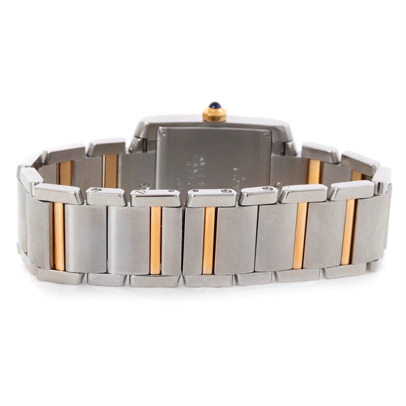 The image shows the back view and bracelet of the Cartier Tank Française watch, highlighting its two-tone metal links.