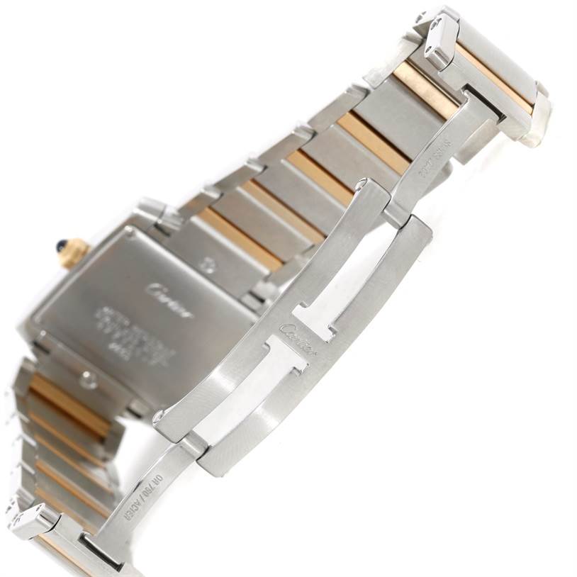 The image shows the clasp and part of the bracelet of a Cartier Tank Francaise W51012Q4 Women's Steel and Gold (two tone) Silver Dial W51012Q4 Women's Steel and Gold (two tone) Silver Dial watch from an angled perspective.