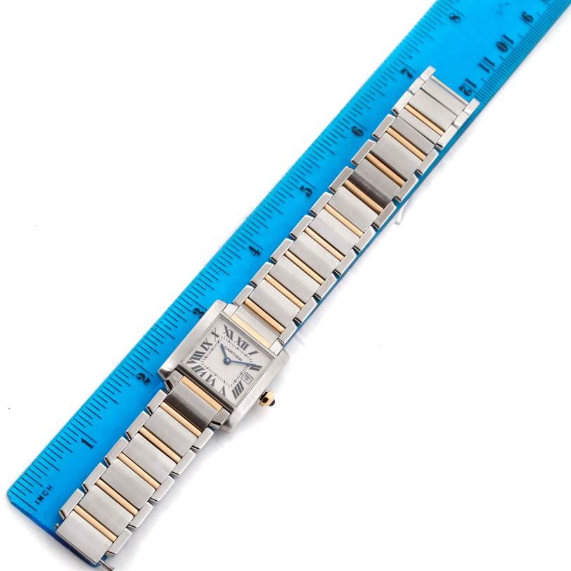 This image shows a top-down view of a Cartier Tank Francaise W51012Q4 Women's Steel and Gold (two tone) Silver Dial W51012Q4 Women's Steel and Gold (two tone) Silver Dial watch with a ruler for scale.