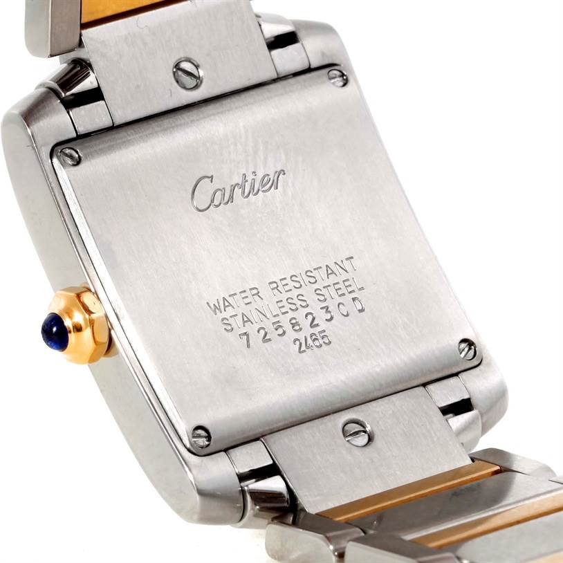 The image shows the back case and part of the bracelet of a Cartier Tank Francaise W51012Q4 Women's Steel and Gold (two tone) Silver Dial W51012Q4 Women's Steel and Gold (two tone) Silver Dial watch, highlighting its stainless steel casing and serial number.