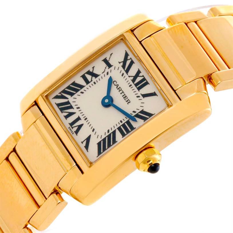 This image shows a close-up of the Cartier Tank Française watch's face, crown, and part of the gold bracelet.