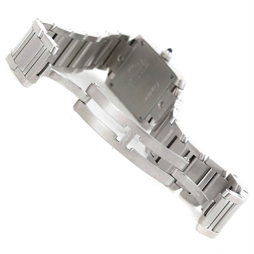 The image shows the back and bracelet of a Tank Française watch by Cartier, highlighting the metal links and clasp.