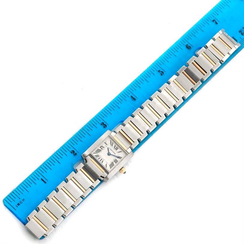 The Cartier Tank Francaise W51007Q4 Women's Steel and Gold (two tone) Silver Dial W51007Q4 Women's Steel and Gold (two tone) Silver Dial watch is shown from a top-down angle, including the face and entire bracelet, placed alongside a ruler.