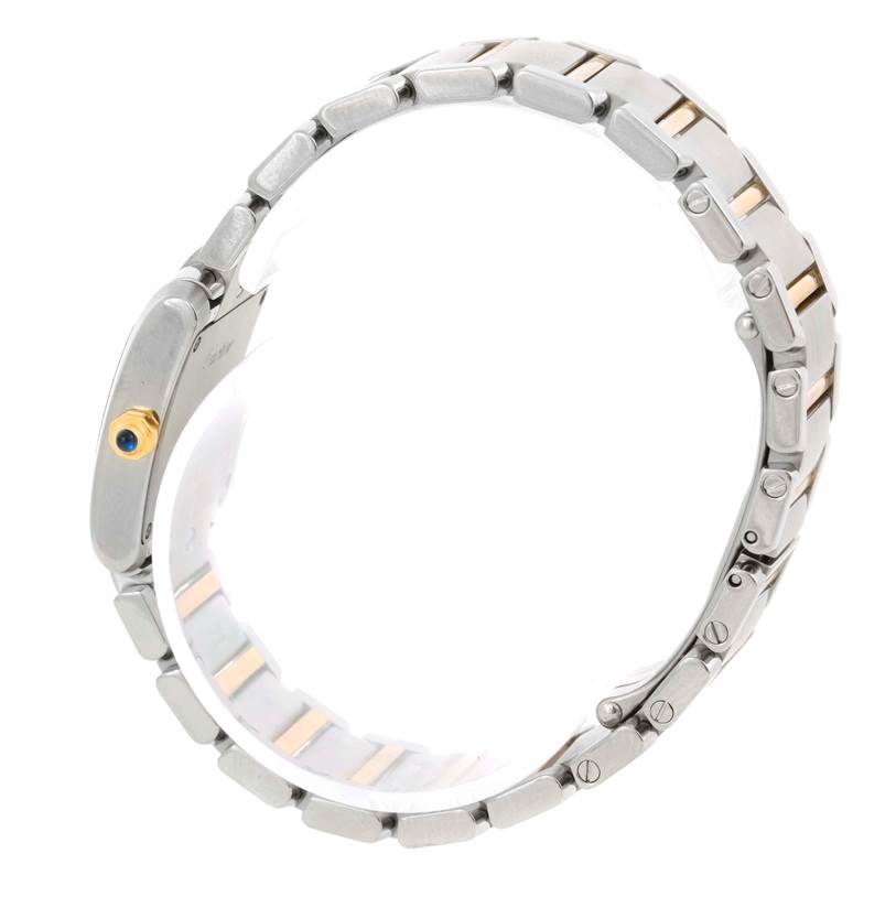 This image shows a side view of the bracelet and crown of a Cartier Tank Française watch.