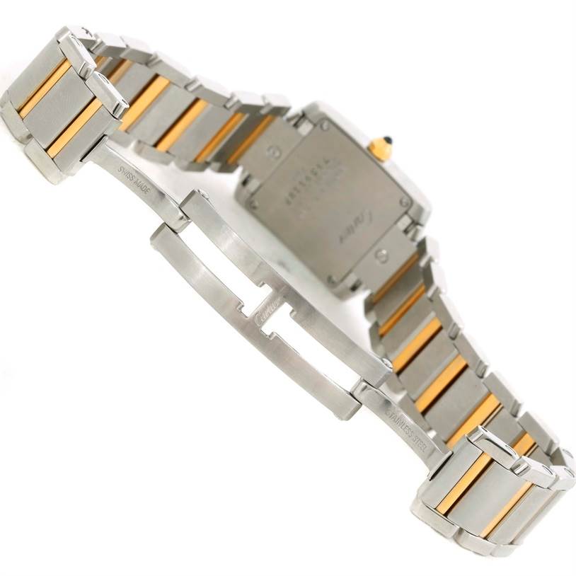 The image shows the back of the Cartier Tank Française watch and its partially open bracelet clasp.