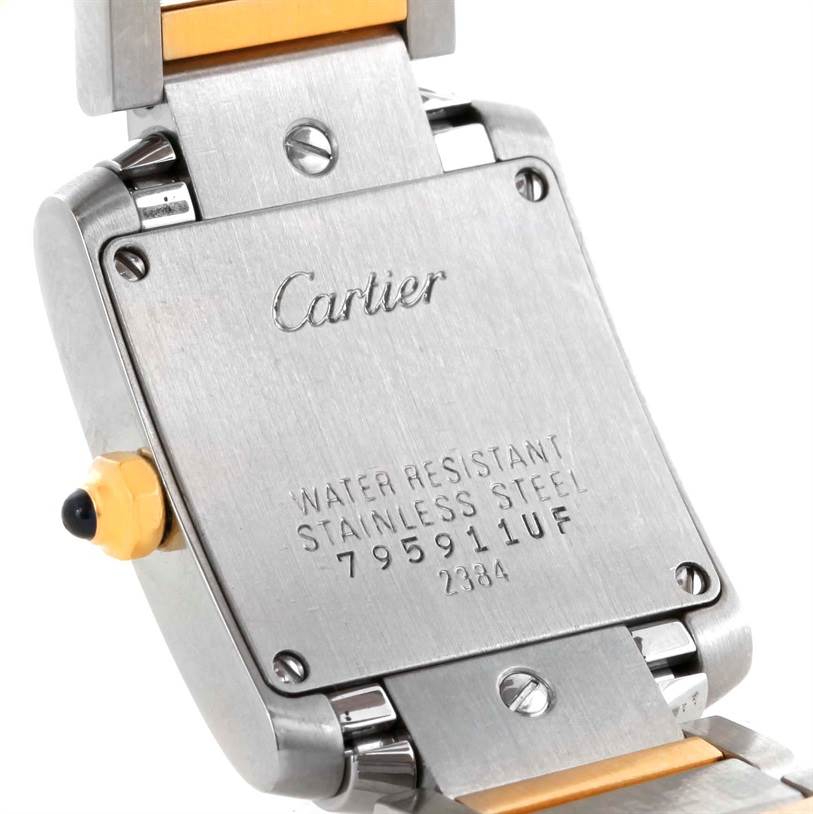 The image shows the back case and partial bracelet of a Cartier Tank Francaise W51007Q4 Women's Steel and Gold (two tone) Silver Dial W51007Q4 Women's Steel and Gold (two tone) Silver Dial watch, displaying water resistance information and serial numbers.