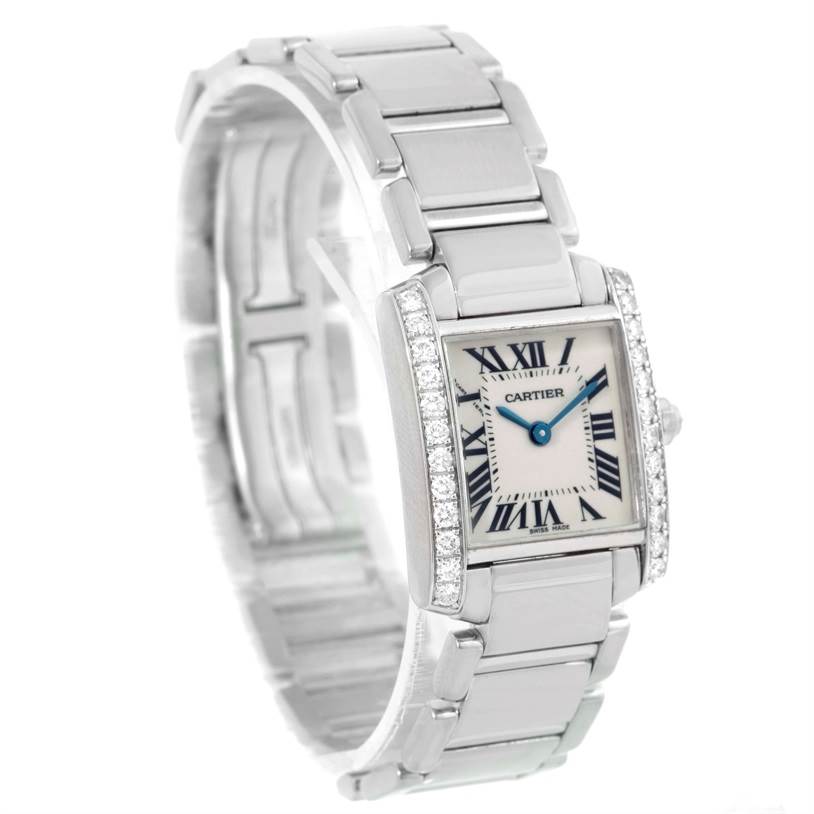 The image shows a Cartier Tank Francaise WE1002S3 Women's White Gold Silver Dial WE1002S3 Women's White Gold Silver Dial watch at an angle that highlights the face and the bracelet.
