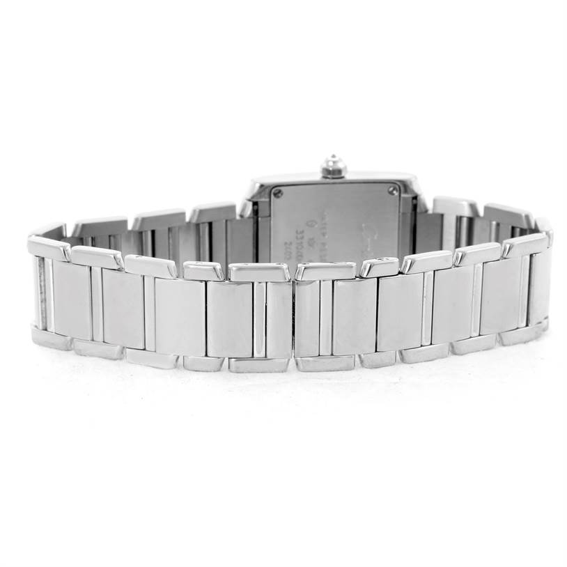 The image shows the back and bracelet of a Cartier Tank Française watch with a stainless steel strap.