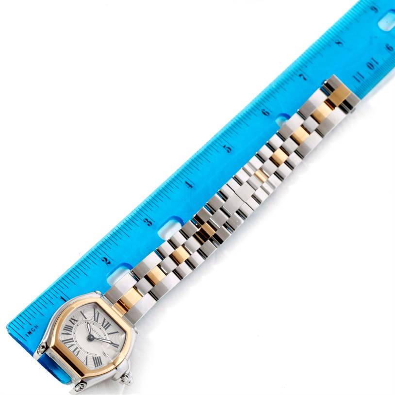 The Cartier Roadster W62026Y4 Women's Steel and Gold (two tone) Silver Dial W62026Y4 Women's Steel and Gold (two tone) Silver Dial watch is shown with its bracelet extended, measured against a blue ruler.