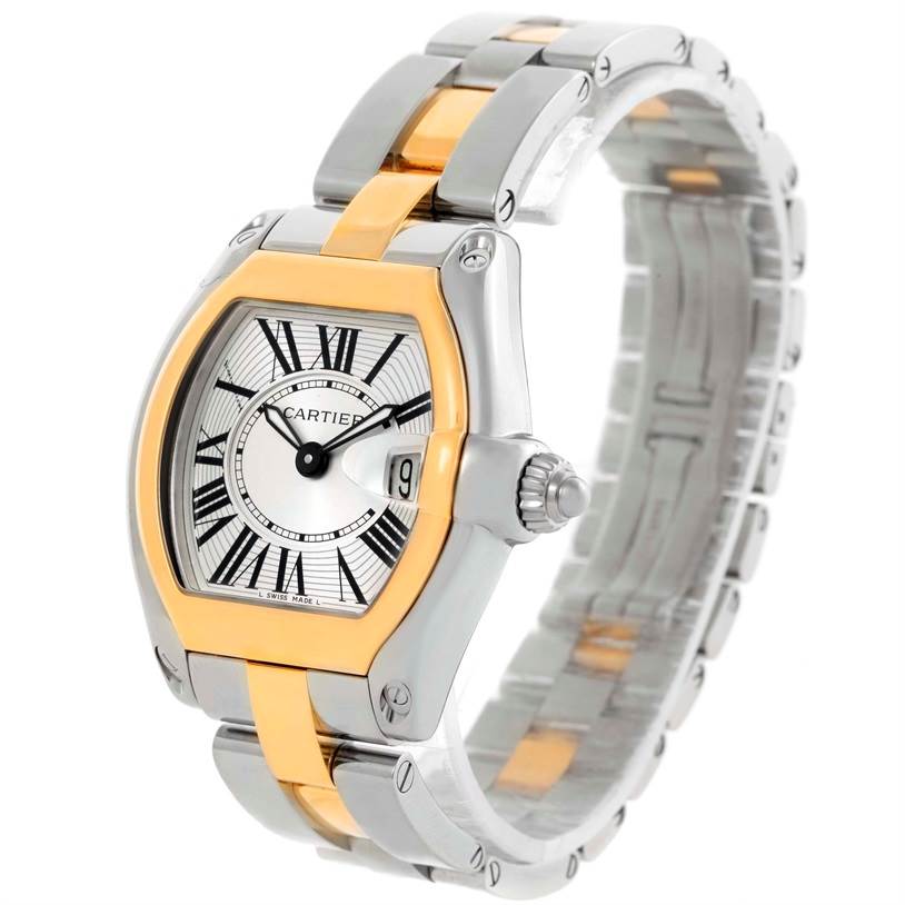 This Cartier Roadster W62026Y4 Women's Steel and Gold (two tone) Silver Dial W62026Y4 Women's Steel and Gold (two tone) Silver Dial watch is shown at an angle highlighting the face, dial, crown, and part of the bracelet.