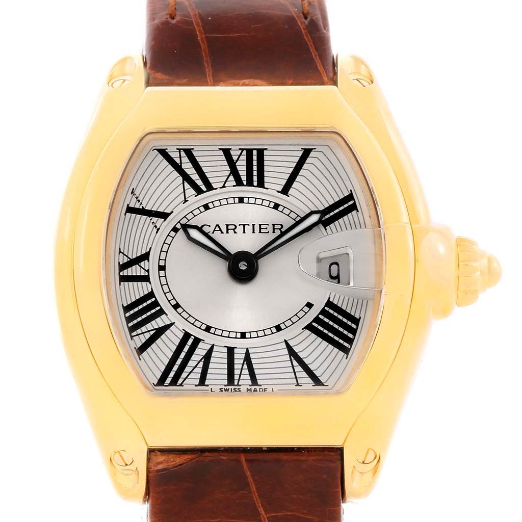 This image shows a frontal view of a Cartier Roadster W62018Y5 Women's Yellow Gold Silver Dial W62018Y5 Women's Yellow Gold Silver Dial watch, highlighting its face, dial, crown, and brown leather strap.
