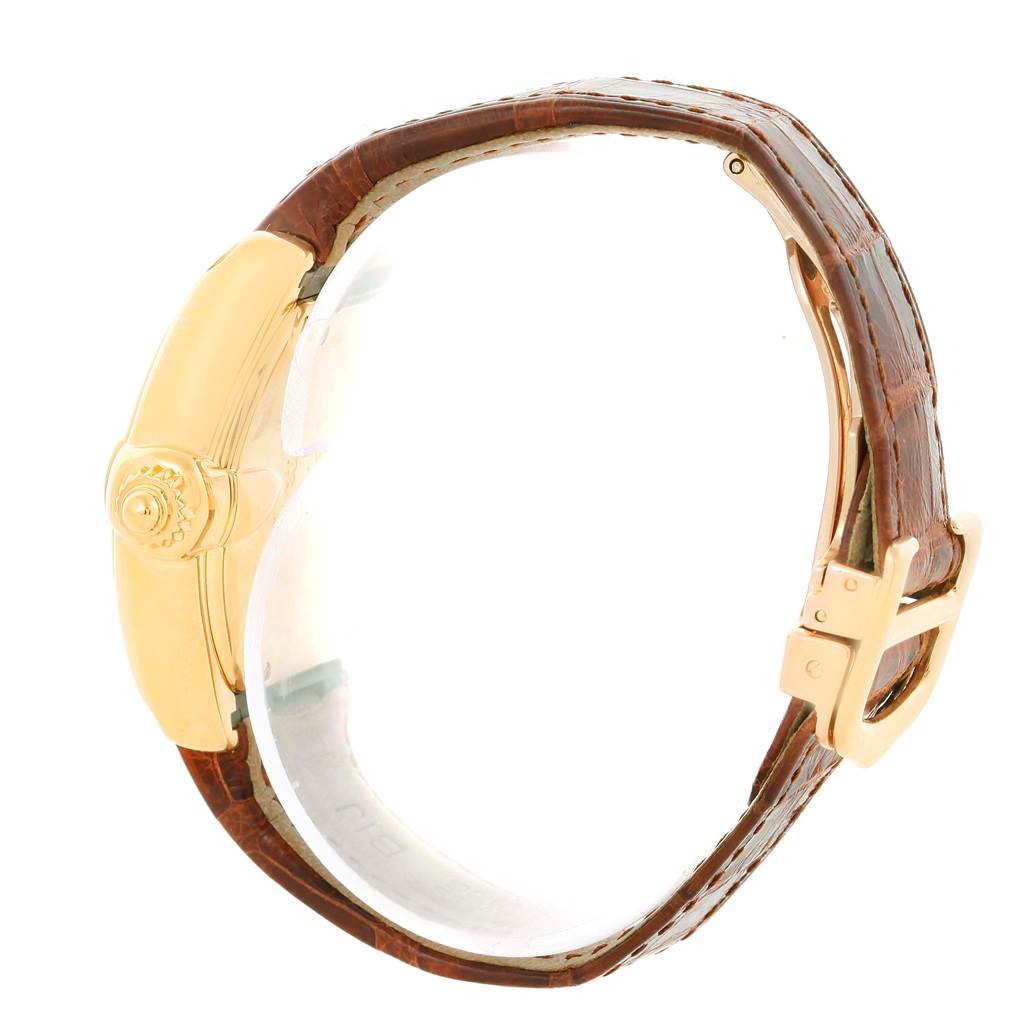 This image displays a side view of the Cartier Roadster W62018Y5 Women's Yellow Gold Silver Dial W62018Y5 Women's Yellow Gold Silver Dial watch, focusing on the gold case, crown, and brown leather strap with a gold buckle.