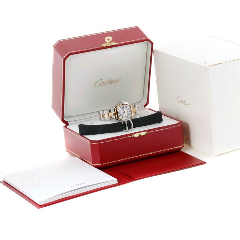 The Cartier Roadster W62026Y4 Women's Steel and Gold (two tone) Silver Dial W62026Y4 Women's Steel and Gold (two tone) Silver Dial watch is displayed in an open red box, also showing a booklet and outer white box.