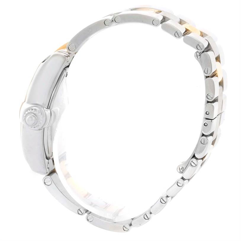 The image shows a side view of the Cartier Roadster W62026Y4 Women's Steel and Gold (two tone) Silver Dial W62026Y4 Women's Steel and Gold (two tone) Silver Dial watch focusing on the case, crown, and metal bracelet.