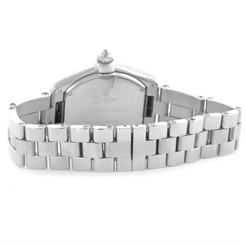 The Roadster model by Cartier is shown from the back, highlighting its stainless steel chain bracelet and case back.