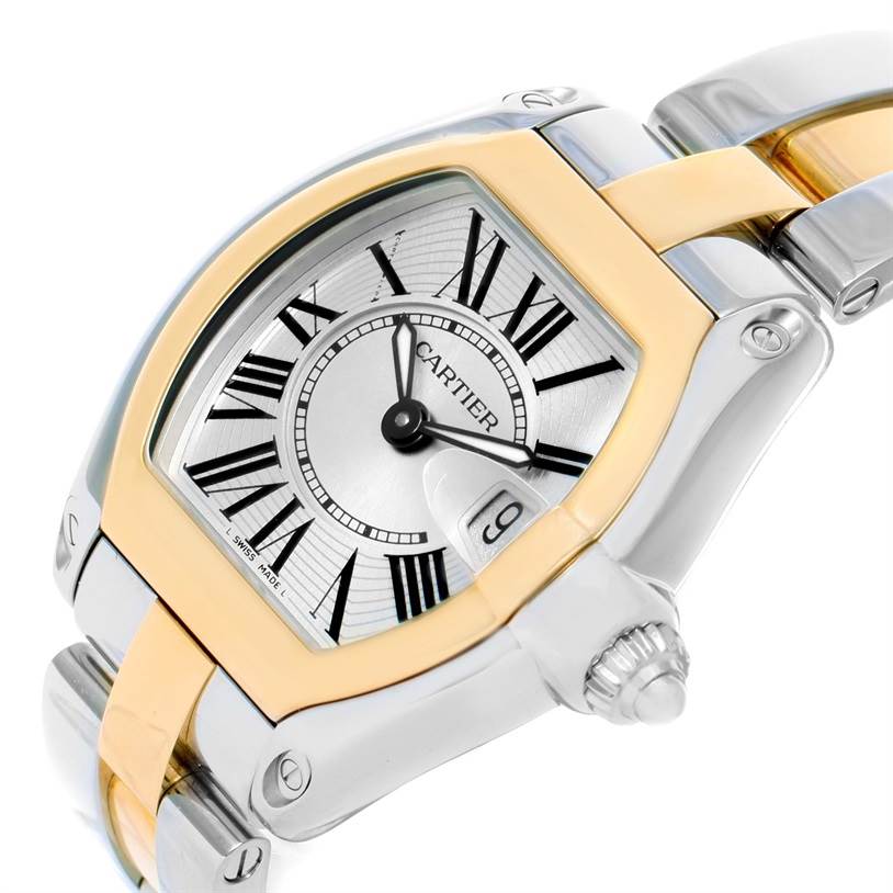 This image shows the face and partial bracelet of a Cartier Roadster W62026Y4 Women's Steel and Gold (two tone) Silver Dial W62026Y4 Women's Steel and Gold (two tone) Silver Dial watch at an angled close-up view.