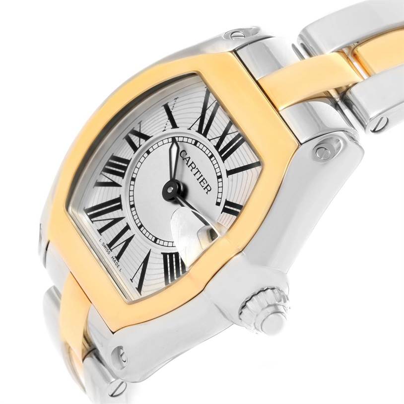 The image shows a close-up angled view of the Cartier Roadster W62026Y4 Men's Steel and Gold (two tone) Silver Dial W62026Y4 Men's Steel and Gold (two tone) Silver Dial watch, highlighting the face, bezel, and part of the bracelet.