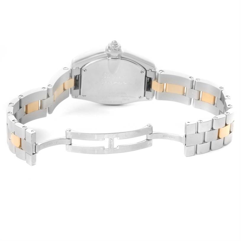 This image shows the back and band of a Cartier Roadster W62026Y4 Men's Steel and Gold (two tone) Silver Dial W62026Y4 Men's Steel and Gold (two tone) Silver Dial watch with an opened clasp.