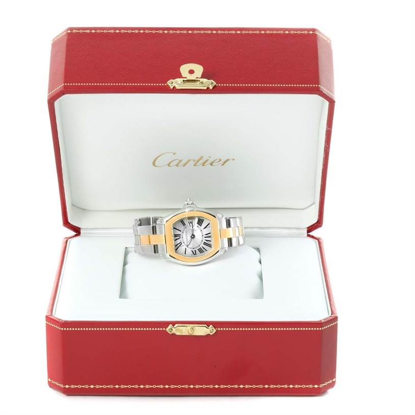 The Cartier Roadster W62026Y4 Men's Steel and Gold (two tone) Silver Dial W62026Y4 Men's Steel and Gold (two tone) Silver Dial watch is shown from a front angle, displayed inside an open red Cartier box.