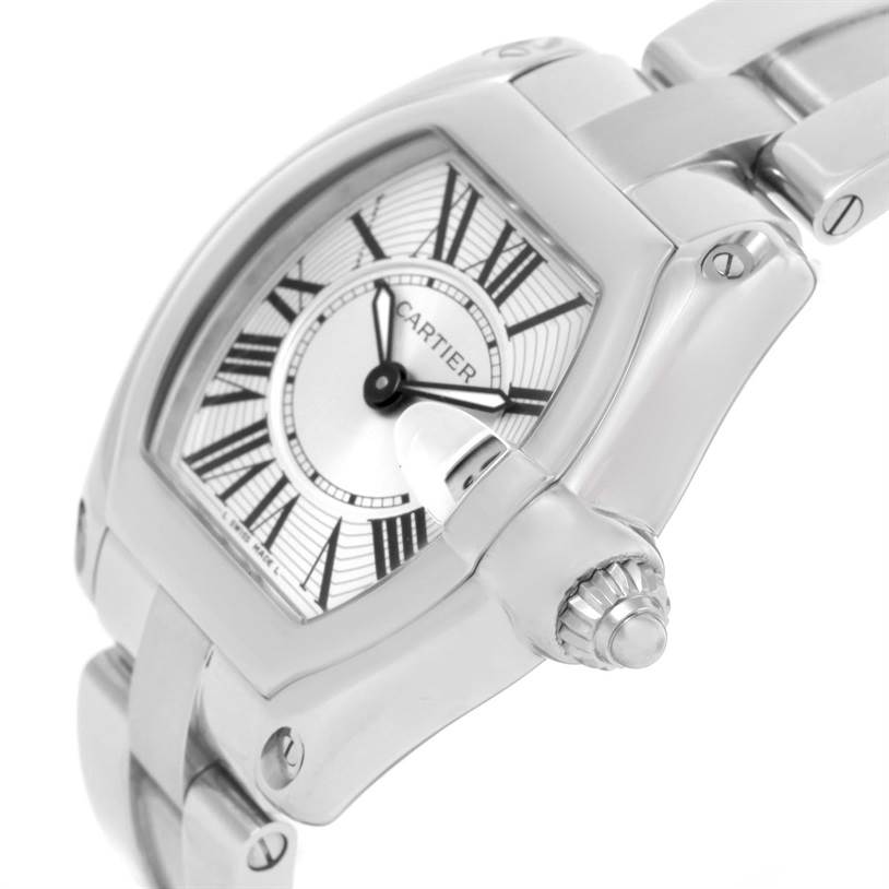 The image shows a close-up side angle of the Cartier Roadster W62016V3 Women
s Stainless Steel Silver Dial W62016V3 Women
s Stainless Steel Silver Dial watch, highlighting its case, dial, bezel, crown, and part of the bracelet.
