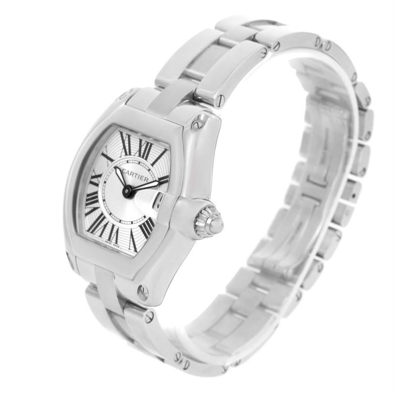 The image shows the Cartier Roadster W62016V3 Women
s Stainless Steel Silver Dial W62016V3 Women
s Stainless Steel Silver Dial watch at an angle, displaying the face, crown, and a portion of the stainless steel bracelet.