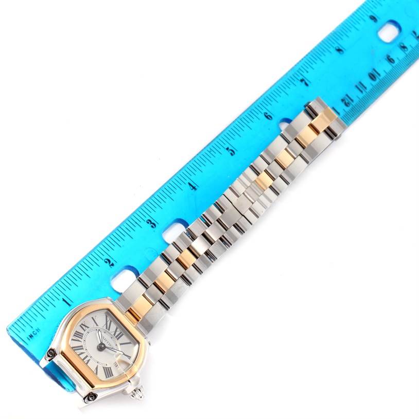 The image shows the Cartier Roadster W62026Y4 Women's Steel and Gold (two tone) Silver Dial W62026Y4 Women's Steel and Gold (two tone) Silver Dial watch positioned diagonally with a ruler measuring its length.