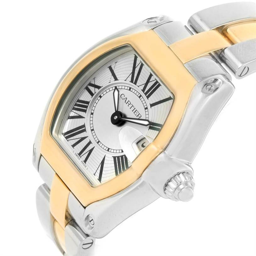 The image shows a close-up of the dial, crown, and part of the bracelet of the Cartier Roadster W62026Y4 Women's Steel and Gold (two tone) Silver Dial W62026Y4 Women's Steel and Gold (two tone) Silver Dial watch.