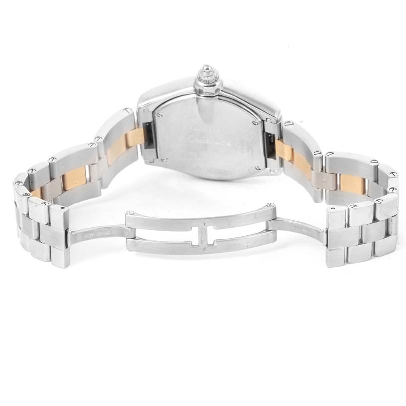 The image shows the back view and partially opened metal bracelet of a Cartier Roadster W62026Y4 Women's Steel and Gold (two tone) Silver Dial W62026Y4 Women's Steel and Gold (two tone) Silver Dial watch.