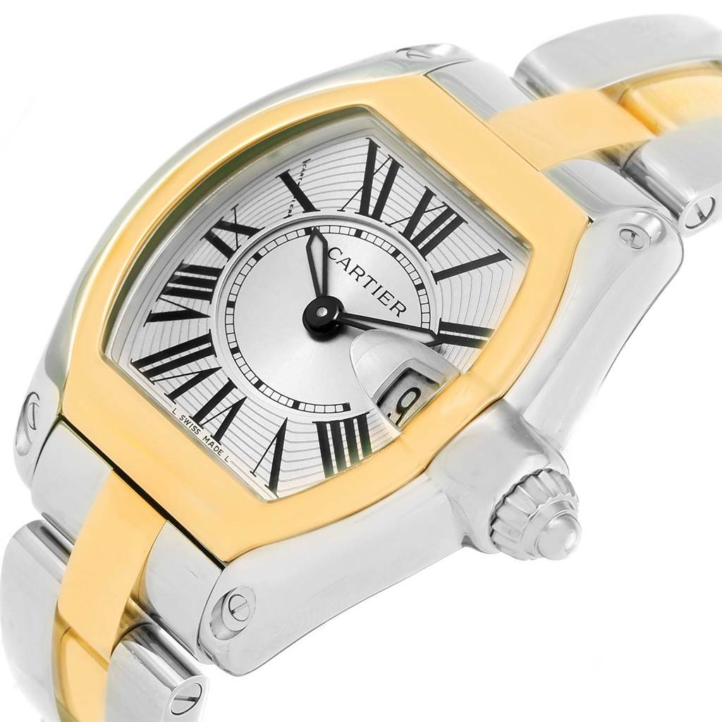 This Cartier Roadster W62026Y4 Women's Steel and Gold (two tone) Silver Dial W62026Y4 Women's Steel and Gold (two tone) Silver Dial watch is shown at an angled close-up, highlighting the dial, bezel, and part of the bracelet.