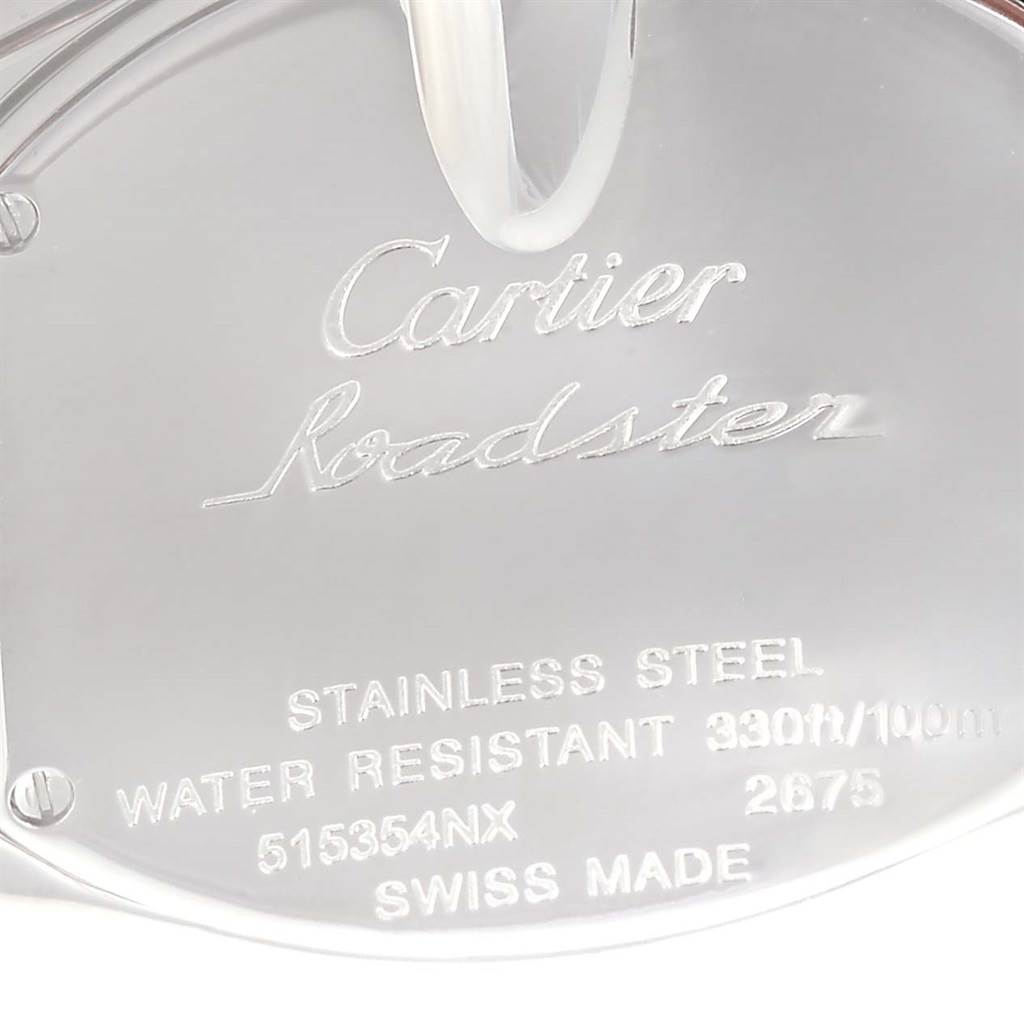 The image shows a close-up of the engraved back of a Cartier Roadster W62016V3 Women's Stainless Steel Silver Dial W62016V3 Women's Stainless Steel Silver Dial watch, detailing specifications like material and water resistance.