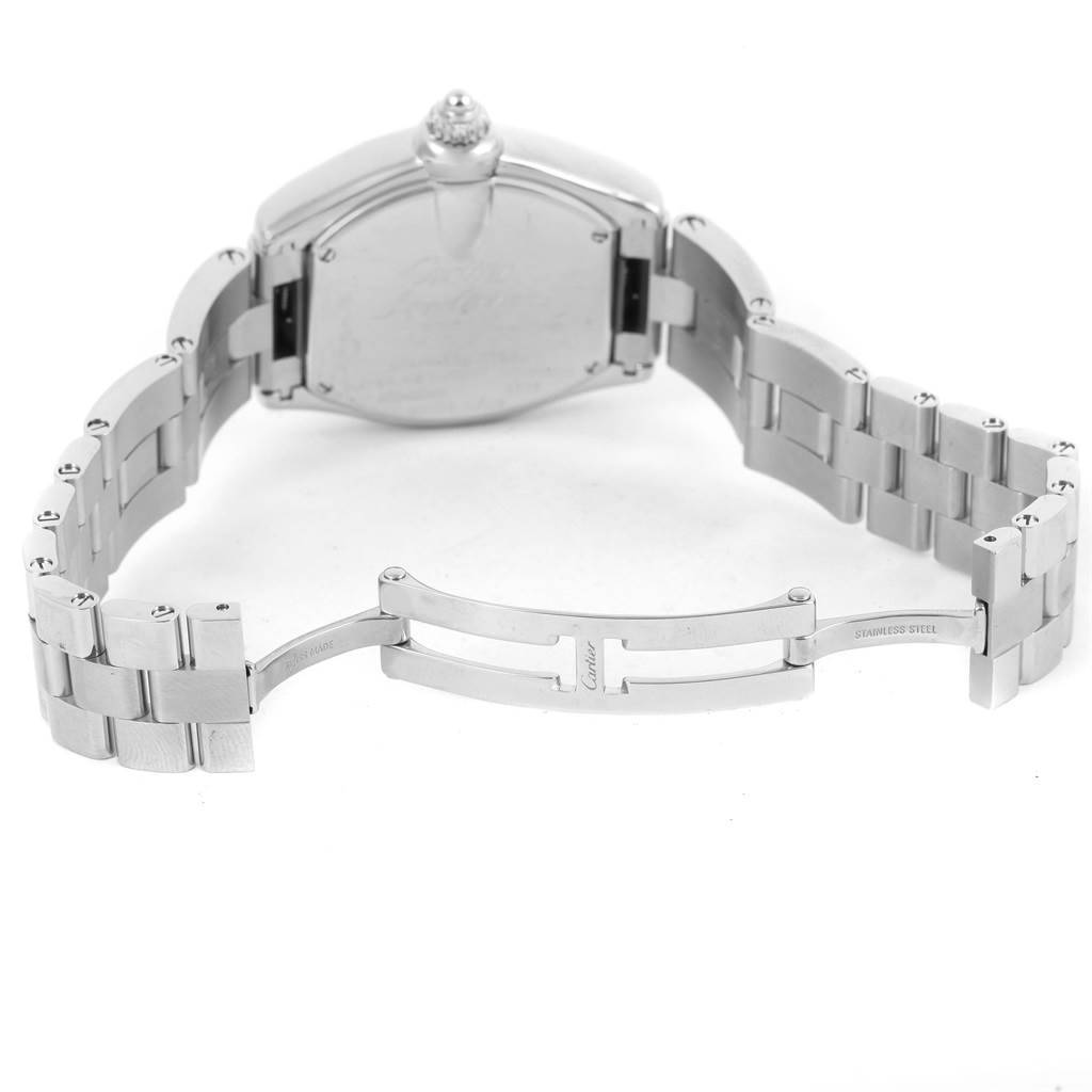 The image shows the backside and open clasp of a Cartier Roadster W62016V3 Women
s Stainless Steel Silver Dial W62016V3 Women
s Stainless Steel Silver Dial watch, emphasizing its stainless steel bracelet and deployment clasp.