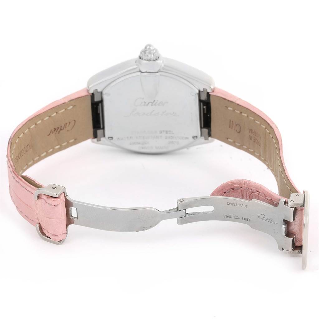 This image shows the back case and partially opened clasp of a Cartier Roadster W6206006 Women's Stainless Steel Mother of Pearl Dial W6206006 Women's Stainless Steel Mother of Pearl Dial watch with a pink leather strap.