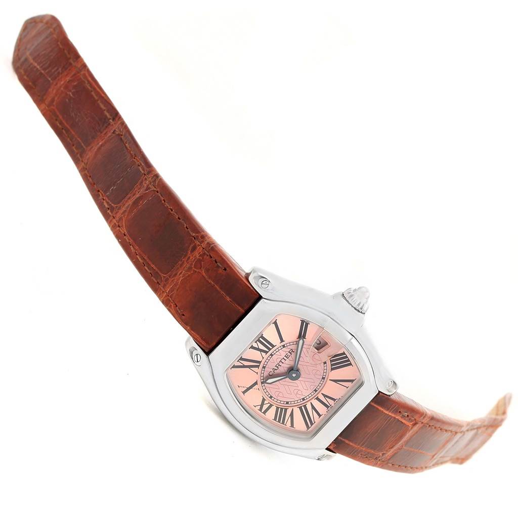 The Cartier Roadster W62043V3 Women's Stainless Steel Pink Dial W62043V3 Women's Stainless Steel Pink Dial watch is shown at a slight angle displaying the dial, case, crown, and brown leather strap.