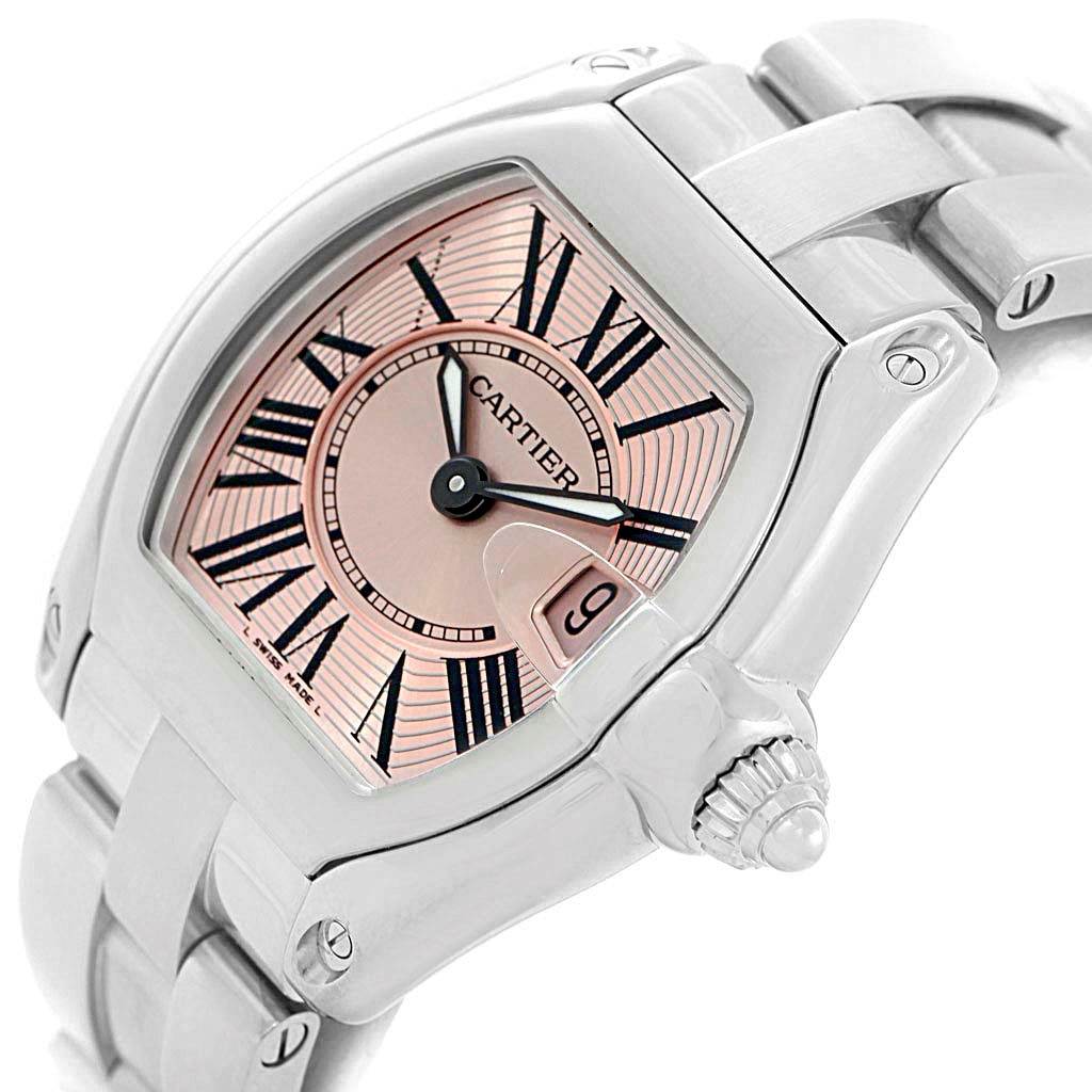 This image shows a close-up view of the dial, case, and bracelet of a Cartier Roadster W62017V3 Women's Stainless Steel Pink Dial W62017V3 Women's Stainless Steel Pink Dial watch.