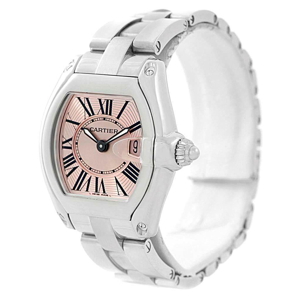 The image shows a Cartier Roadster W62017V3 Women's Stainless Steel Pink Dial W62017V3 Women's Stainless Steel Pink Dial watch at an angled view, displaying the dial, crown, and part of the metal bracelet.