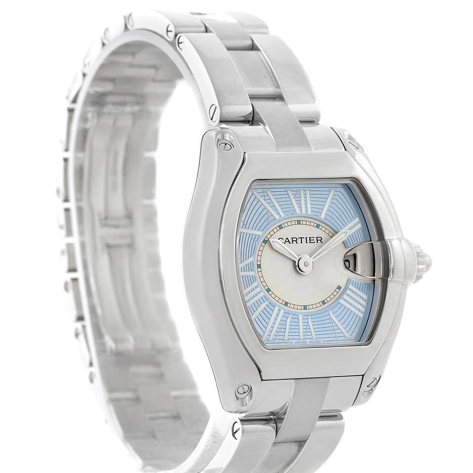The image shows a Cartier Roadster W62053V3 Women's Stainless Steel Blue Dial W62053V3 Women's Stainless Steel Blue Dial watch at a three-quarter angle, highlighting its face, crown, and bracelet.