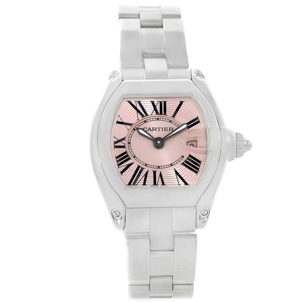 The image shows a front view of a Cartier Roadster W62017V3 Women
s Stainless Steel Pink Dial W62017V3 Women
s Stainless Steel Pink Dial watch, featuring a pink dial, Roman numerals, and a stainless steel bracelet.
