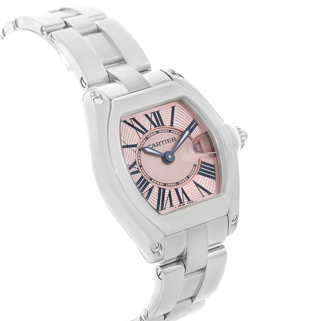 The Cartier Roadster W62017V3 Women
s Stainless Steel Pink Dial W62017V3 Women
s Stainless Steel Pink Dial watch is shown at an angled view highlighting the face, bezel, and part of the bracelet.