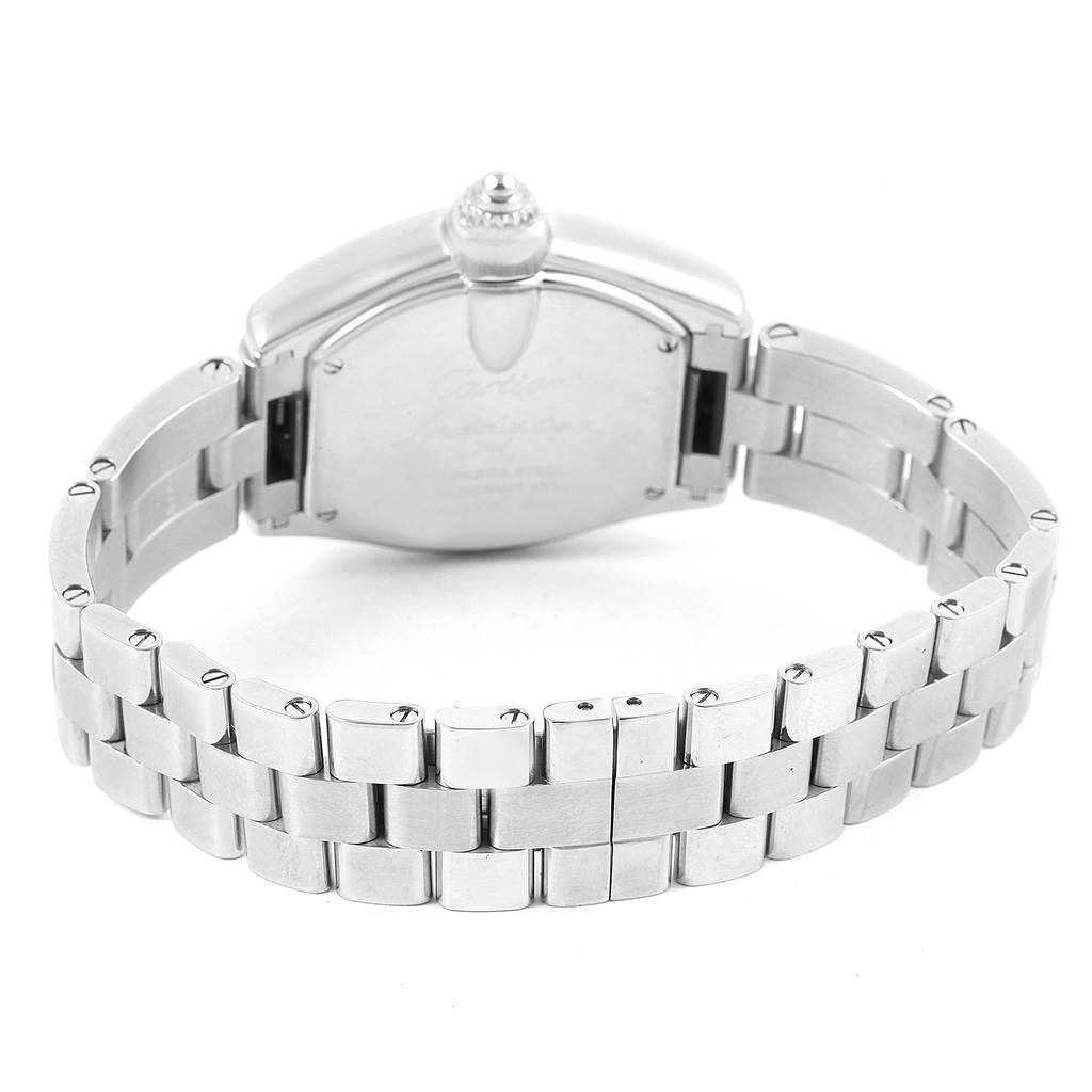 The image shows the back view of the Cartier Roadster W62017V3 Women
s Stainless Steel Pink Dial W62017V3 Women
s Stainless Steel Pink Dial watch, focusing on the case back and a portion of the metal bracelet.