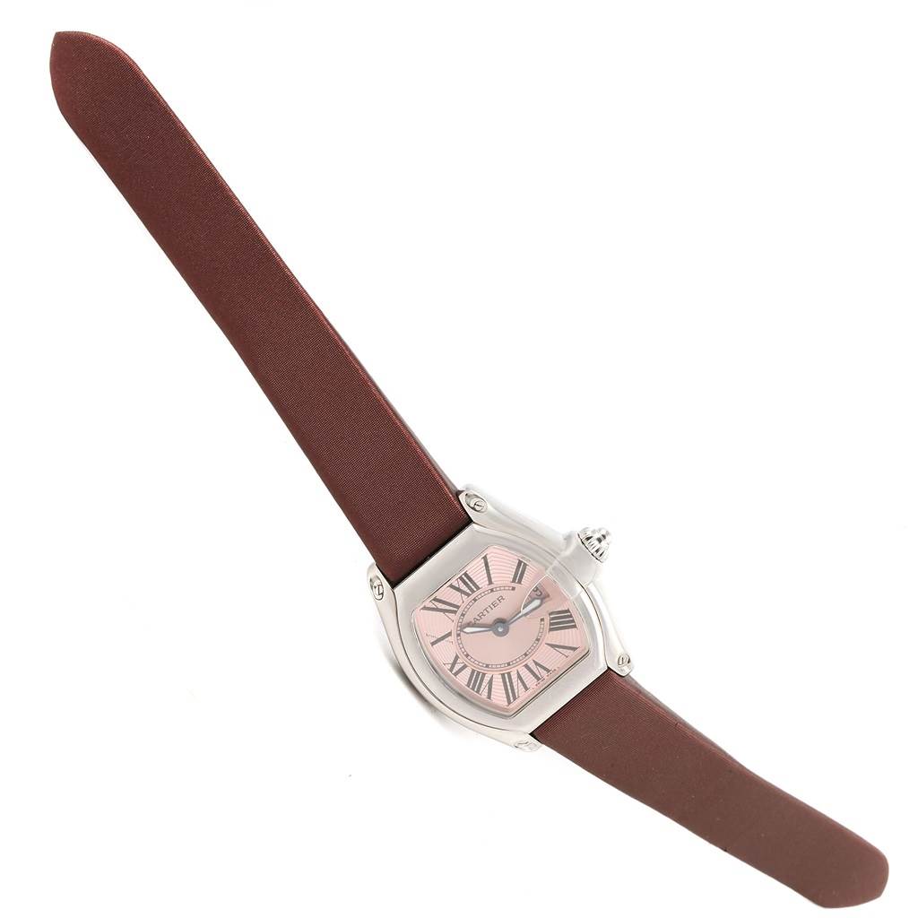 The image shows the full Roadster model watch by Cartier from an angled top-down perspective, including the face and brown leather strap.
