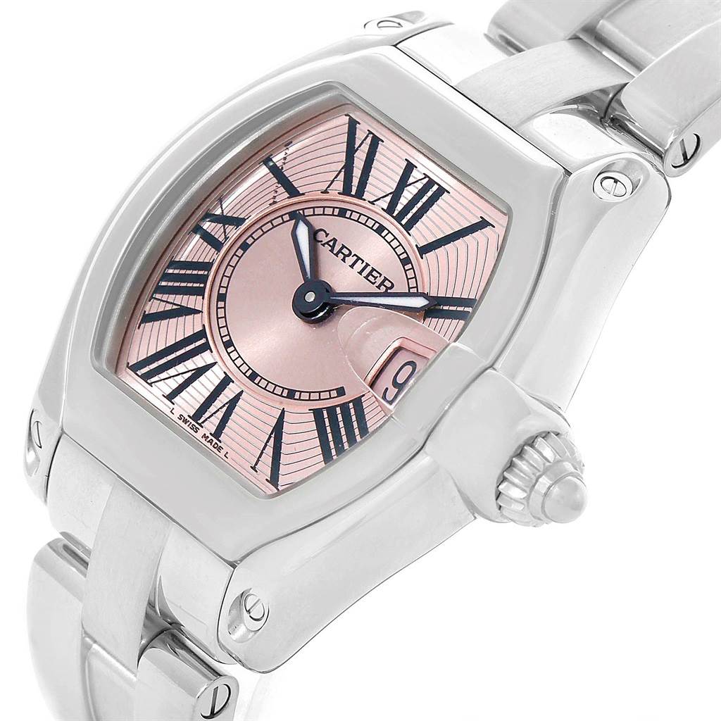 This image shows a close-up of the Cartier Roadster W62017V3 Women
s Stainless Steel Pink Dial W62017V3 Women
s Stainless Steel Pink Dial watch, highlighting its pink dial, Roman numerals, and stainless steel case and bracelet.