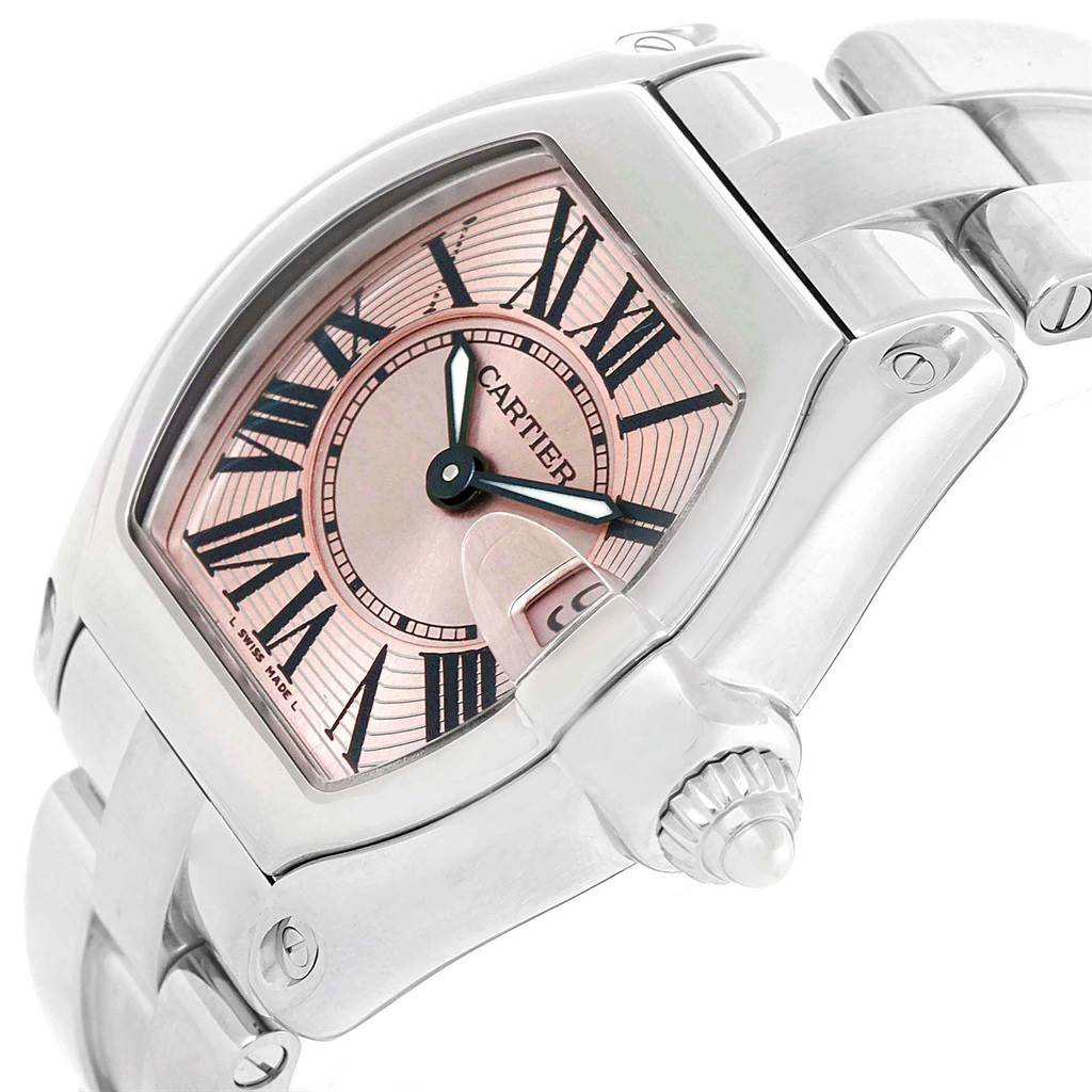 The image shows the dial, crown, and part of the bracelet of a Cartier Roadster W62017V3 Women
s Stainless Steel Pink Dial W62017V3 Women
s Stainless Steel Pink Dial watch at an angle.