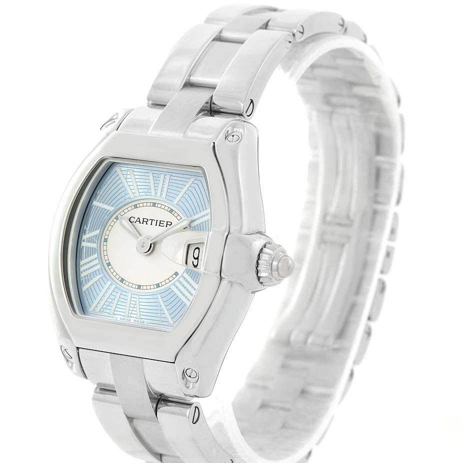 The Cartier Roadster W62053V3 Women's Stainless Steel Blue Dial W62053V3 Women's Stainless Steel Blue Dial watch is shown at a three-quarter angle, highlighting the face, crown, and bracelet.