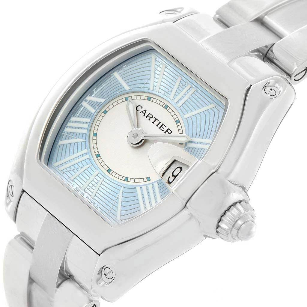 This Cartier Roadster W62053V3 Women's Stainless Steel Blue Dial W62053V3 Women's Stainless Steel Blue Dial watch is shown from a slightly angled top view, displaying its dial, case, and part of the bracelet.