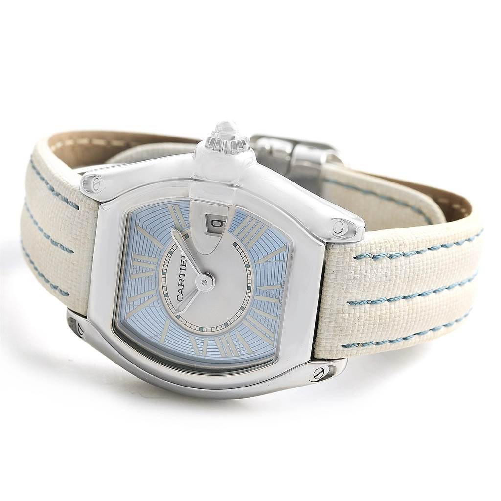 The Cartier Roadster W62053V3 Women's Stainless Steel Blue Dial W62053V3 Women's Stainless Steel Blue Dial watch is shown at an oblique angle highlighting the dial, case, and strap.