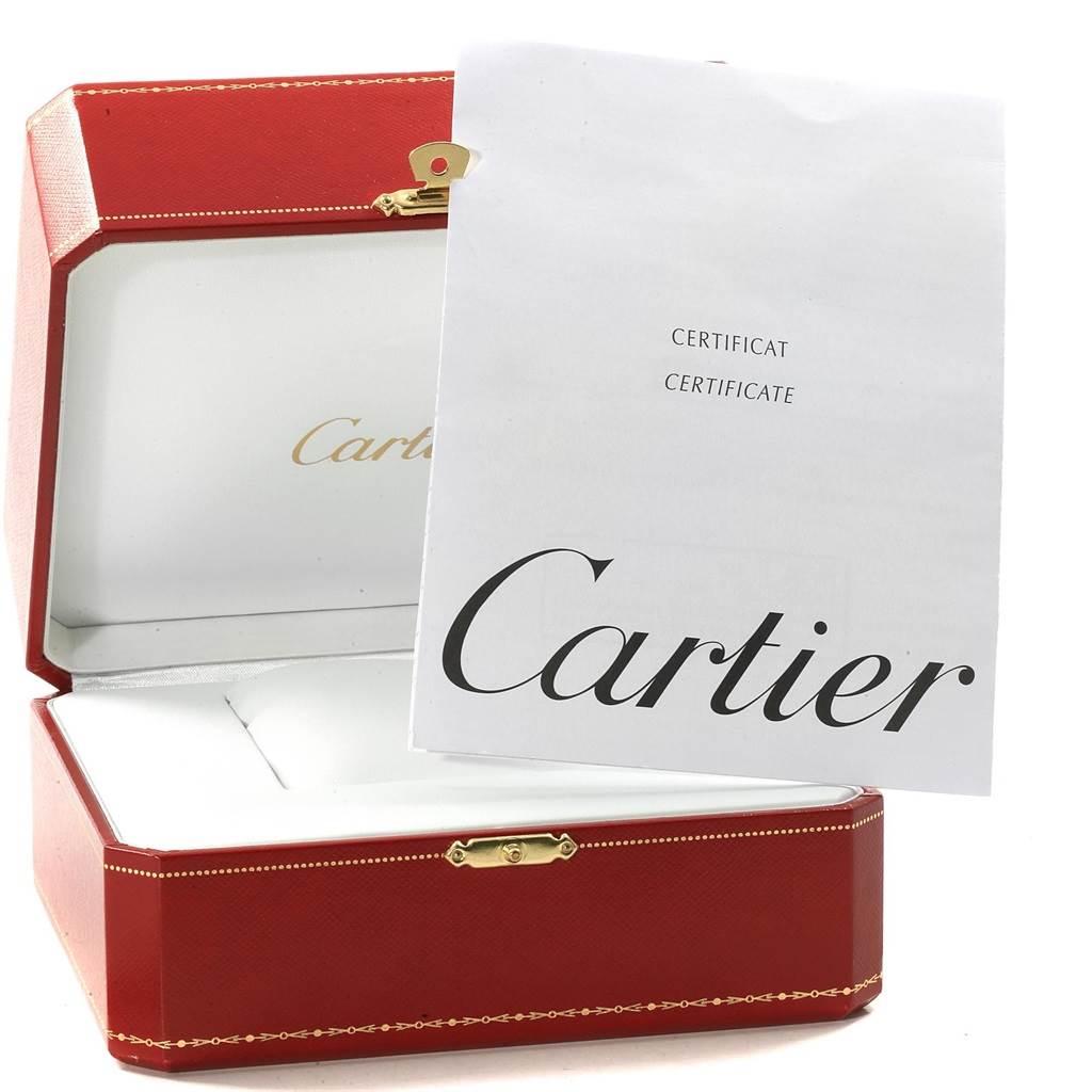 The image shows an open red box and a certificate for the Cartier Roadster W62016V3 Women
s Stainless Steel Silver Dial W62016V3 Women
s Stainless Steel Silver Dial watch, revealing the interior and packaging.