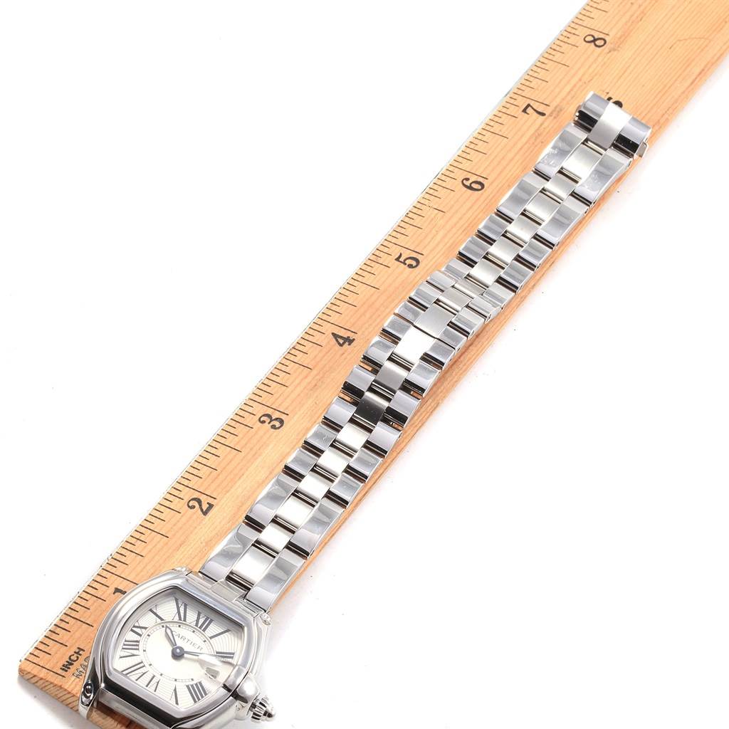 The image shows a Cartier Roadster W62016V3 Women
s Stainless Steel Silver Dial W62016V3 Women
s Stainless Steel Silver Dial watch, angled with the face and metal bracelet displayed alongside a ruler for scale.